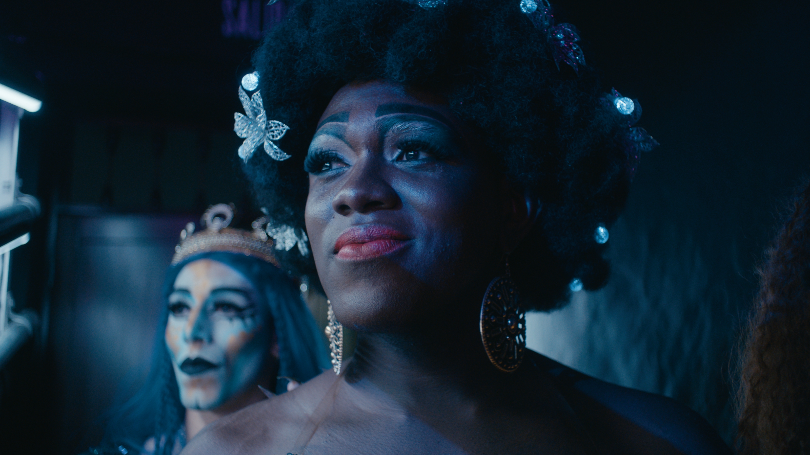 Jacob in blue light, with a crowned figure behind him